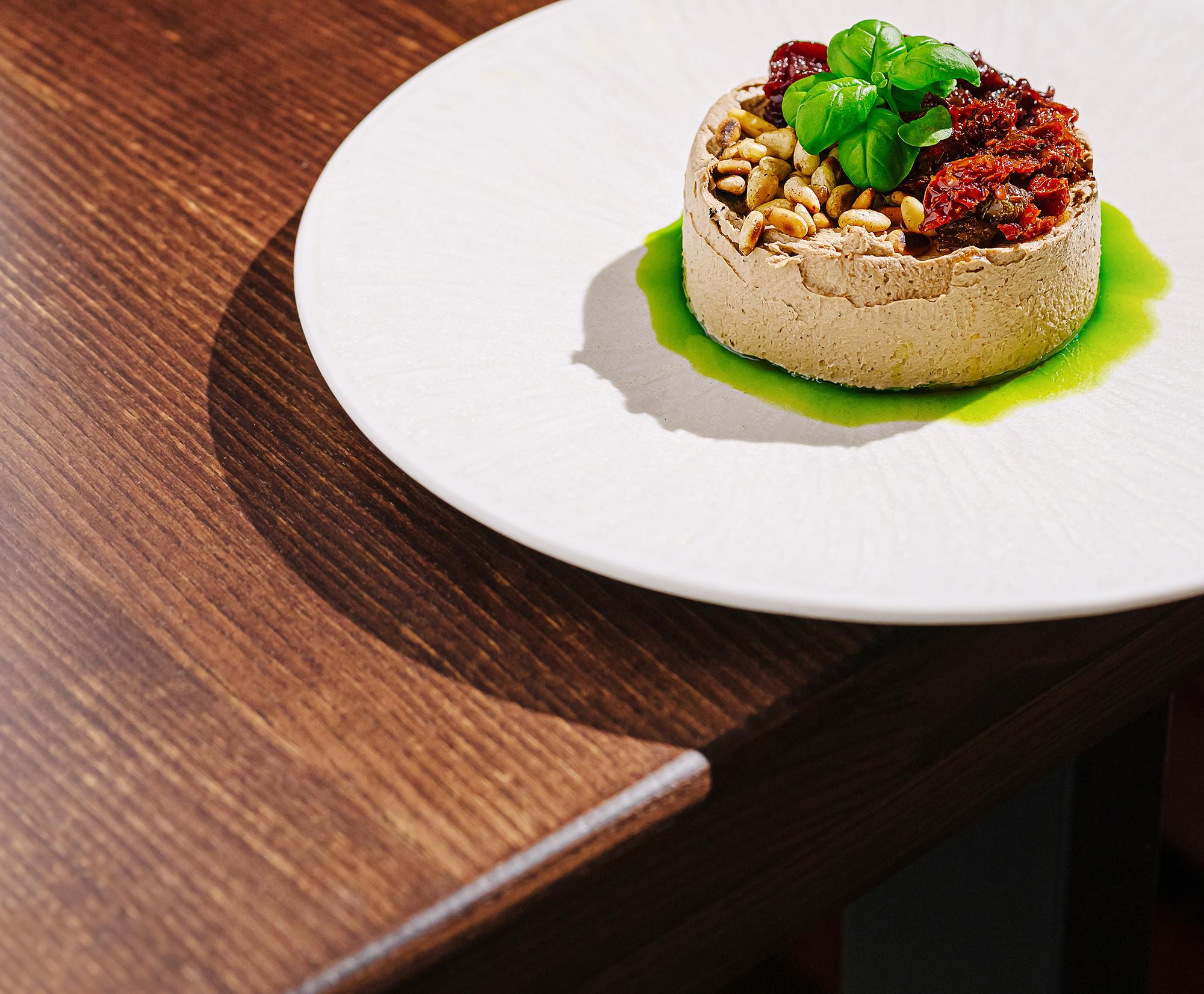 plated tasting menu on wooden table